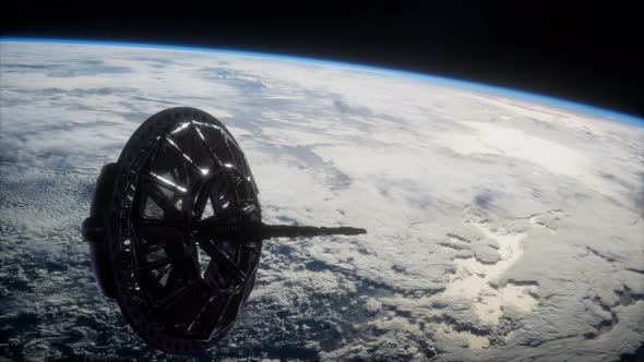 Futuristic Space Satellite Orbiting the Earth alt