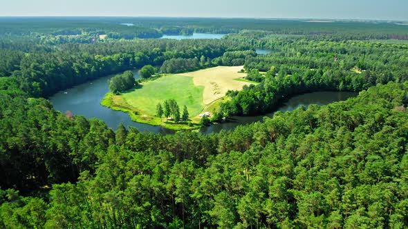 Large river turning back among forests in forest, Zalew Koronowski