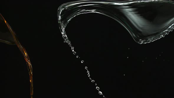 Water and soft drink splash collision in the air, Slow Motion