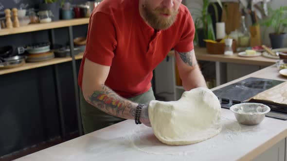 Food Blogger Holding Pizza Dough and Speaking on Camera