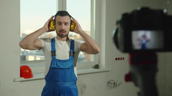 Builder Puts on Headphones and Talks on Camera
