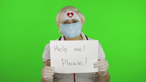 Elderly Female Doctor in Medical Mask Show Page with Message. Coronavirus