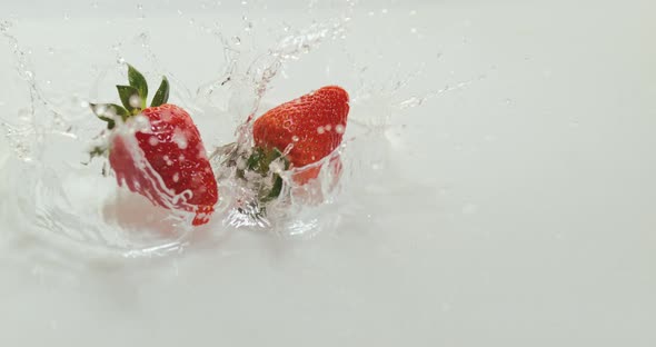 900021 Strawberries, fragaria vesca, Falling on Water, Slow Motion 4K