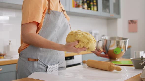 Woman Cooking Food and Kneading Dough on Kitchen