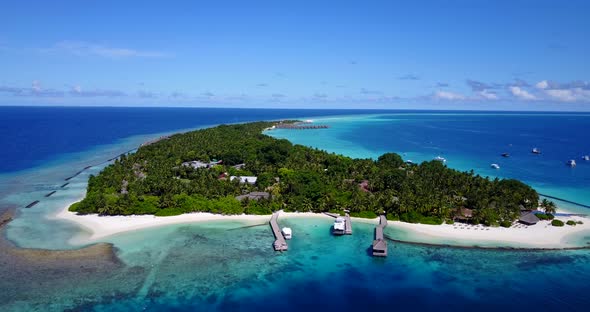 Daytime drone abstract shot of a white paradise beach and blue water background in 4K