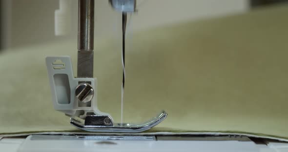 Dressmaker Working on Sewing Machine Closeup