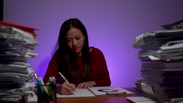 Workaholic people concept. businesswoman working on a laptop computer at night