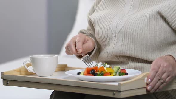 Aged Woman Eating Fresh Salad for Breakfast, Healthy Dieting, Nutrition Quality