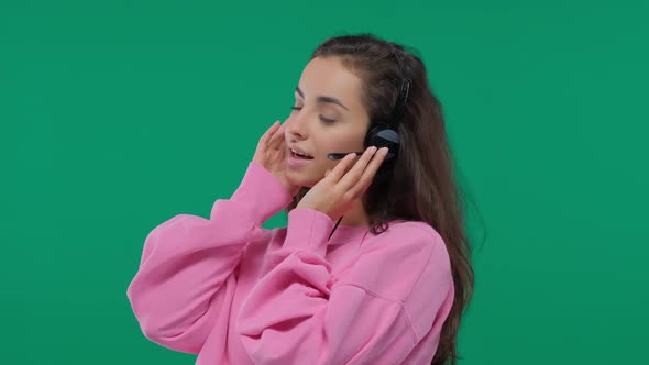 Female Call Center Agent Wearing Headset with Microphone Consults Remotely, Happy Woman Dispatcher