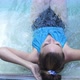 Top of View of Beautiful Young Woman Relaxes in a Hydromassage Jacuzzi in Swimming Pool - VideoHive Item for Sale