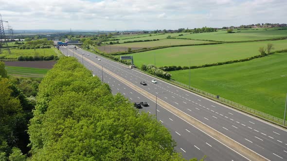 Aerial footage of the motorway in the UK known as the M1 showing traffic on the road in the UK