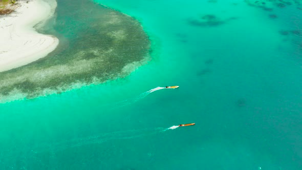 Seascape Coral Reef and Blue Sea with Motorboat