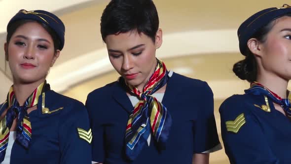 Cabin Crew Dancing with Joy in Airplane