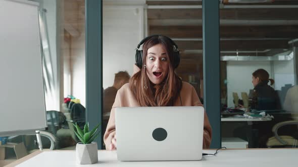 Amazed Happy Millennial Woman Receiving Sms Message Reading Good News