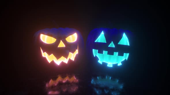 Halloween, Two Pumpkins with a Scary Face Glow From the Inside in Two Different Colors. Bright Neon