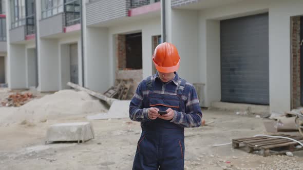 Portrait of an Architect Who Holds His Phone