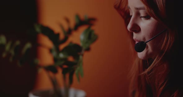 Businesswoman in Headset Working in Office