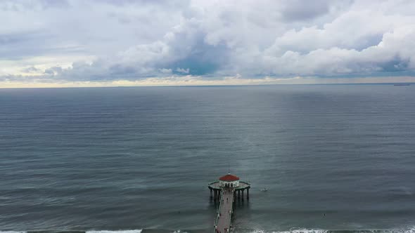 Aerial View Of Manhattan Beach Pier With Roundhouse Aquarium In California On A Cloudy Day - drone s