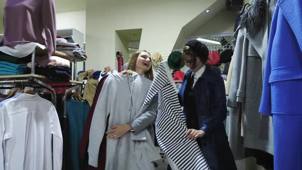 Girls walking laughing in a store