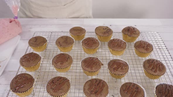 Drizzling Chocolate Ganache on Top of Bake Chocolate Raspberry Cupcakes