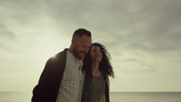 Multiethnic Couple Walking Beach on Sunset Sea