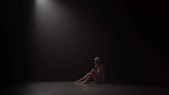 Woman with Long Hair Dancing Contemp at Studio Under Spotlight