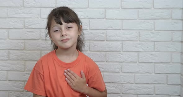 Girl Folded Hands on Heart Chest