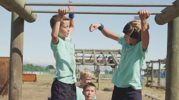 Group of Caucasian children training at boot camp