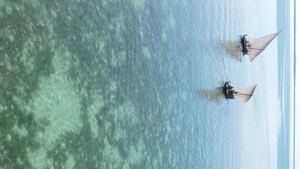 Tanzania Vertical Video  Boat Boats in the Ocean Near the Coast of Zanzibar Aerial View