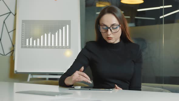 Woman Working with Tablet in the Office