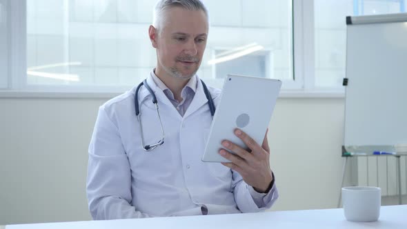 Online Video Chat on Tablet by Doctor