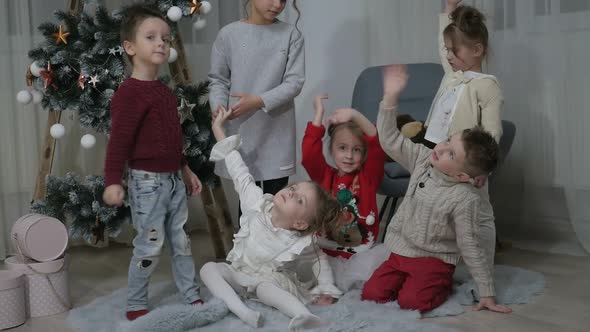 A group of children with New Year's gifts, happy friends for Christmas