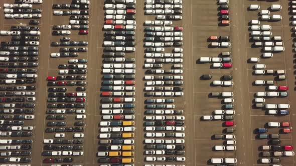 Many new and occasion Cars on a huge parking lot waiting for shipment, Aerial