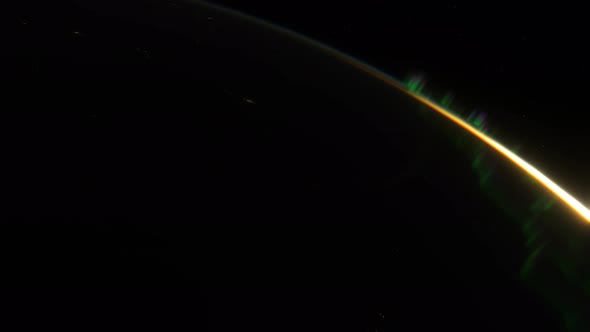 Spaceship Flies Over the Night Side of the Planet Earth