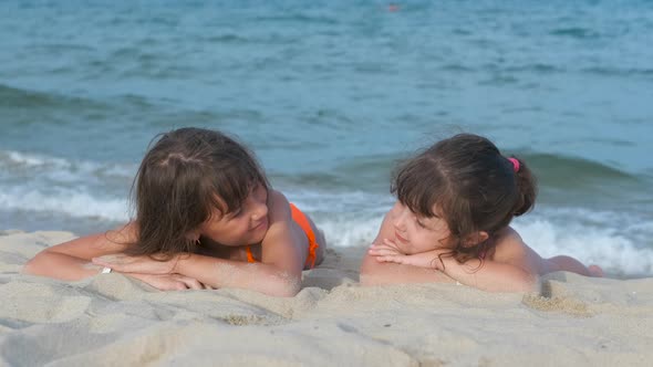 Happy children on the beach.  alt