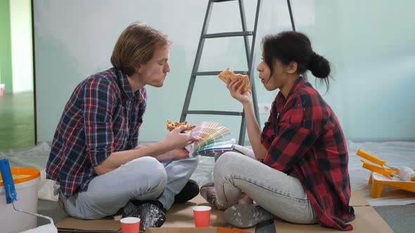 Couple Choosing Color From Palette, Eating Pizza