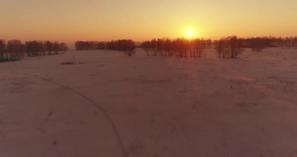 Aerial Drone View of Cold Winter Landscape with Arctic Field, Trees Covered with Frost Snow 