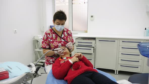 Dentist treating a little patient