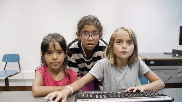 Girls Looking at Monitor and Learning Computer Science