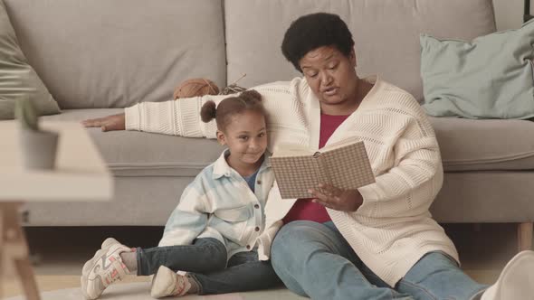 Granny Reading to Girl