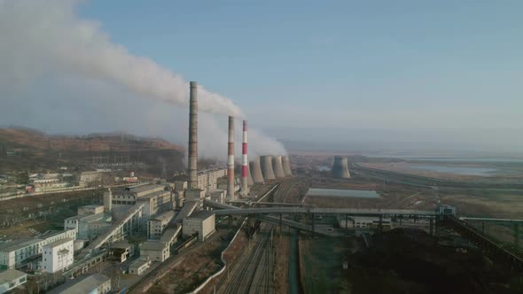 Aerial View of an Industrial Zone Pipes Pouring Thick White Smoke