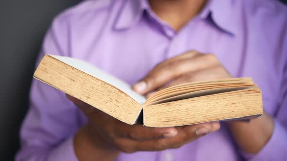 Close Up of Man's Hand Turning a Pager of a Diary