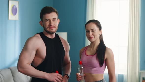 Portrait of Athletic Couple After Training at Home