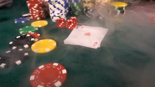 Gambling Red Dices Poker Cards And Money Chips In Smoke