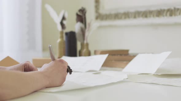 Girl with Beautiful Hands Writing a Letter at the Table