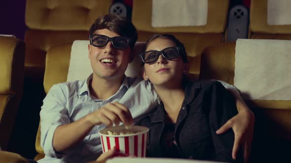 Man and Woman in the Cinema Watching a 3D Movie