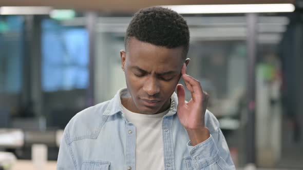 Portrait of African Man having Headache