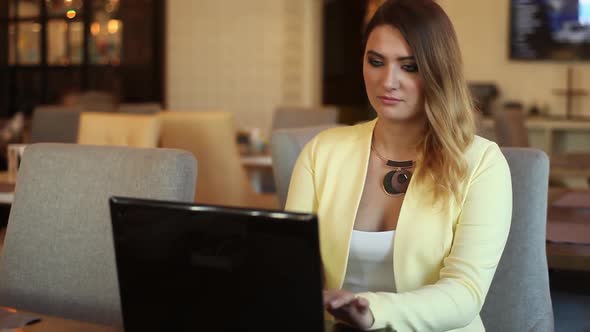 Business Girl Working Using Mobile Computer Sitting at Table