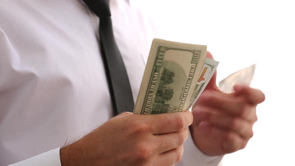 A Man In A White Shirt And Tie Scatters Money. Shows Money. Businessman Made A Lot Of Money