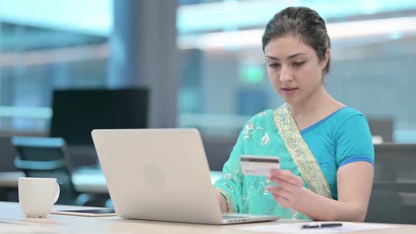 Indian Woman with Unsuccessful Online Shopping On Laptop